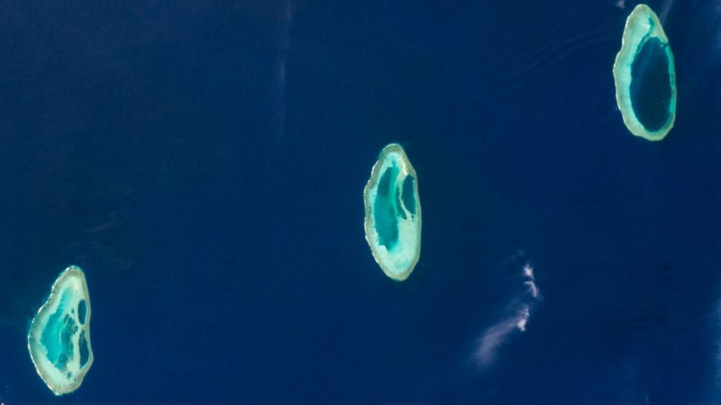 Perfect trio of prehistoric atolls shine like tropical gems off Australian coast  — Earth from space