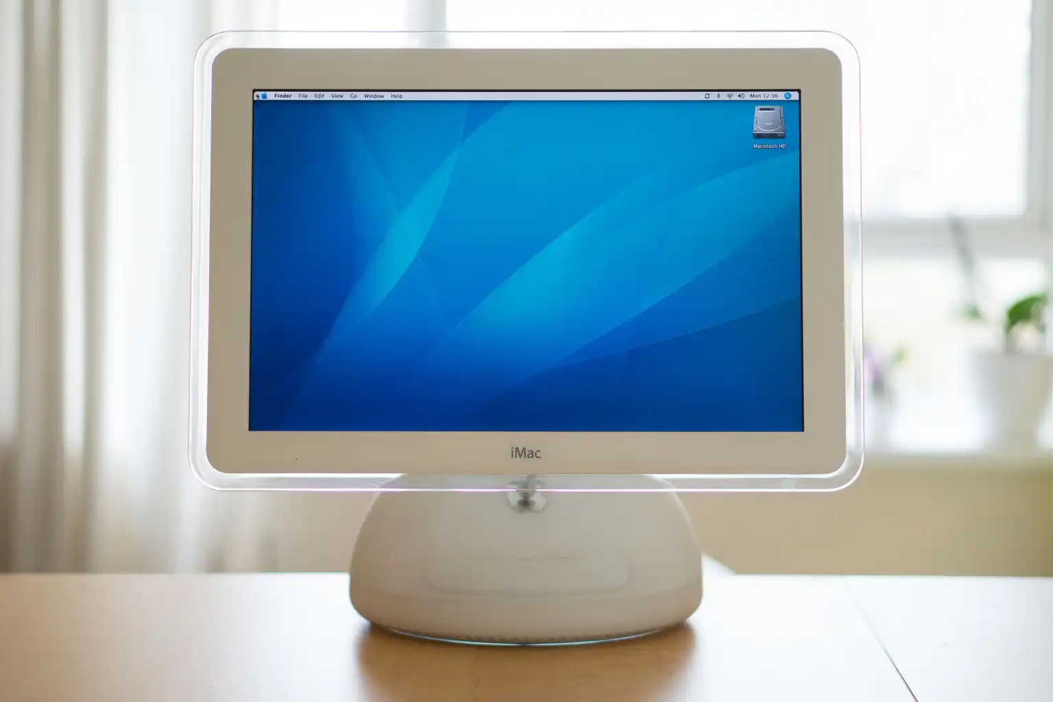 Gaze at the beauty of Liquid Glass on the sunflower iMac G4