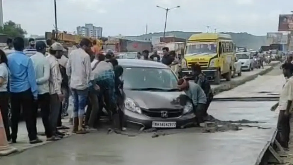 Car trapped in wet cement on Pune highway, triggers traffic jam