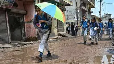 Sonia Vihar students brave waterlogged roads each school day