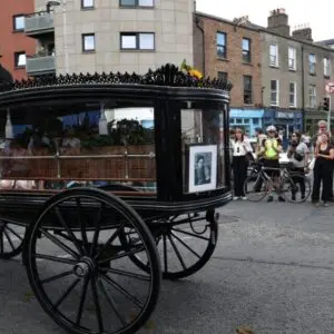 U2 plays rewritten lyrics at Glen Hansard funeral