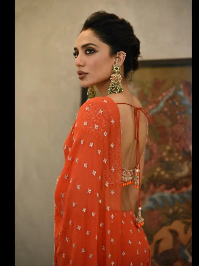 Sobhita Dhulipala wears retro orange saree at Bandla Ganesh wedding