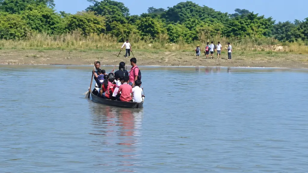 Assam students cross rivers by boat daily no bridge yet