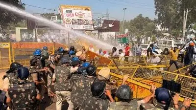 Police fire tear gas as farmers block highway over paddy delay
