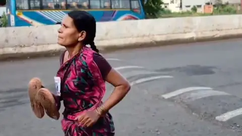 Mum's barefoot race win exposes India's education gap